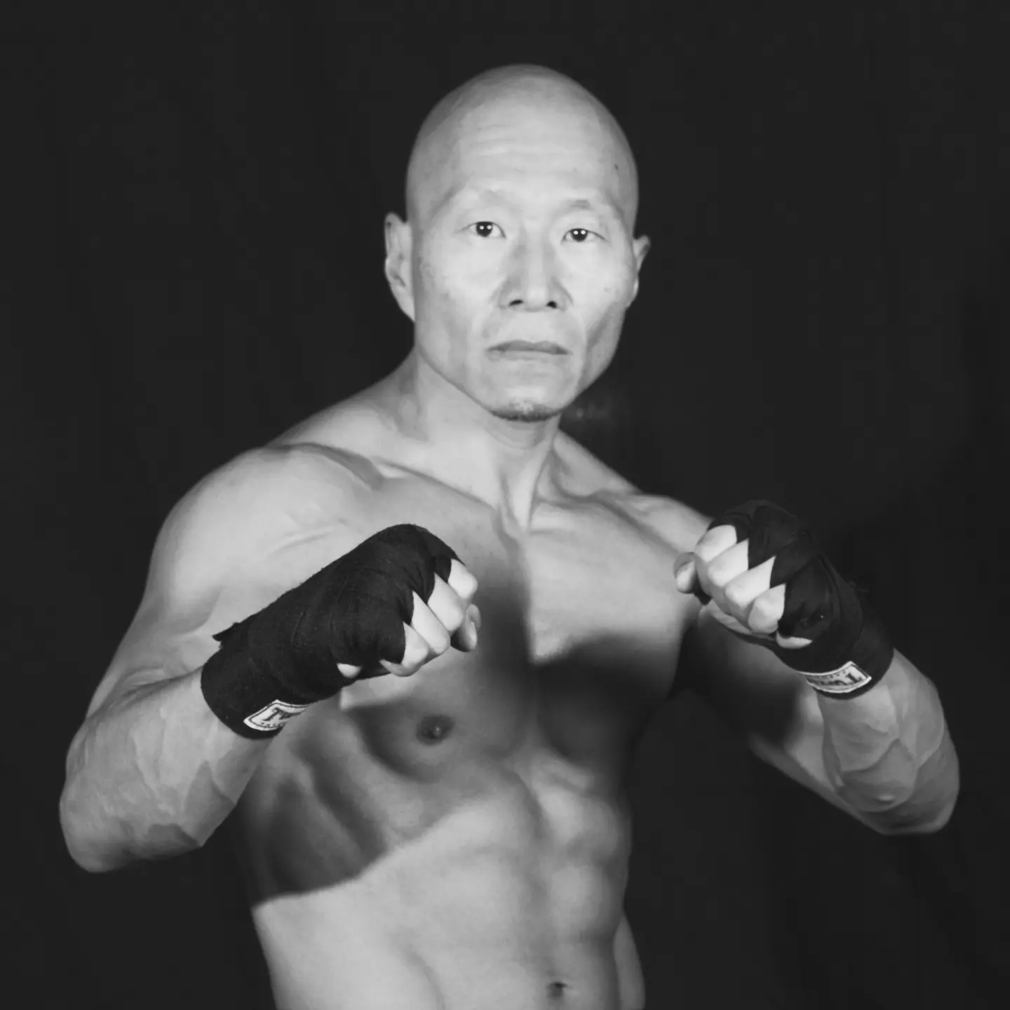 Kru Ray in a Muay Thai guard stance
