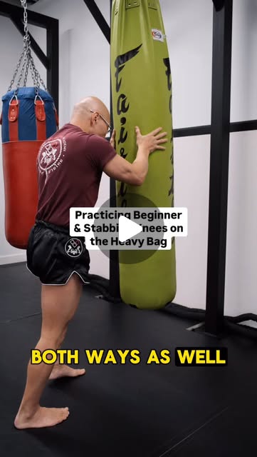Kru Ray demonstrating movement on a heavy bag